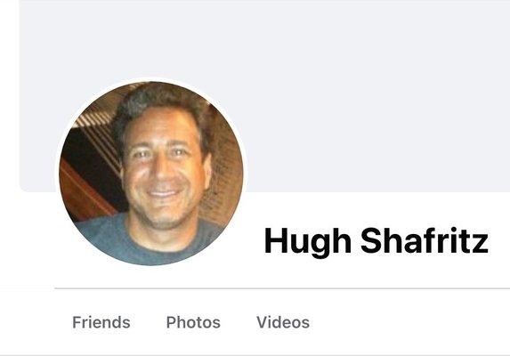 Hugh tries to hide his identity. Here is what he looks like