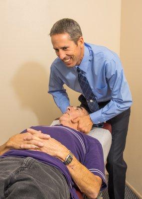 Dr. Bodle working with a patient