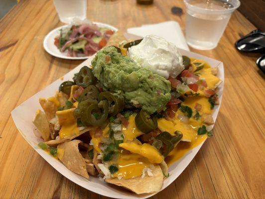 Regular nachos, tons of toppings.