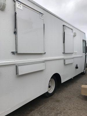 A conversion of a Food Truck adding side windows. 18' long behind the cab!