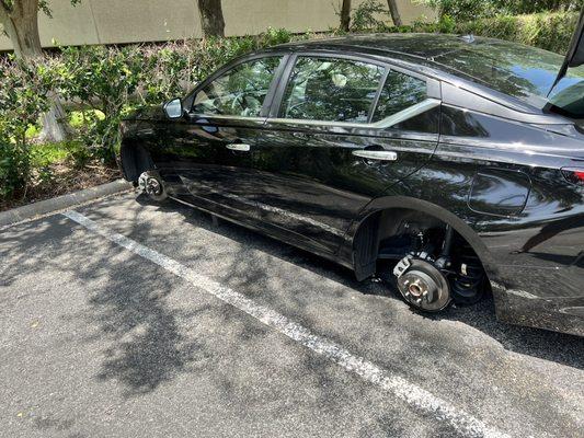 My rental car after thieves stole all 4 tires.