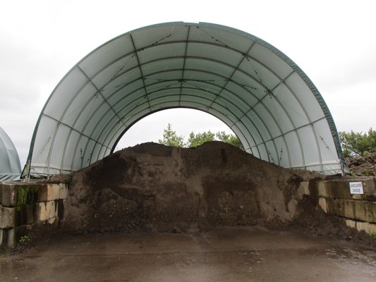 Our Landscapers Choice Blended Soil, Sandy Loam and Garden Compost are kept dry under tents so they are easy to spread even in winter.