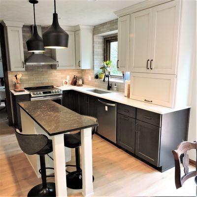 Plato Woodwork cabinets with Vicostone and Caesarstone countertops and Brickstone capella backsplash tile.