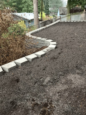 Ground leveling, retaining wall and fence installation. Before/After.