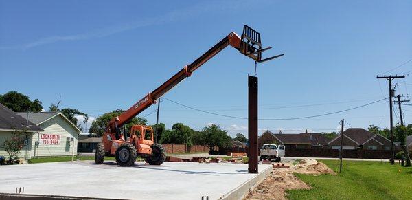 June 19th: Foundation has cured, now time for the metal frame to go up.