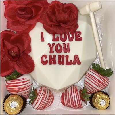 ** White and red "i love you chula" lettering with red dipped white drizzled **