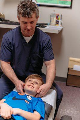 Dr. Paul McCarthy adjusting a patient