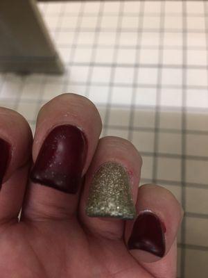 uneven, lumpy, small cut on finger from them, and there's a little polish on my pinky, & gold sparkles got on most of the red by mistake.