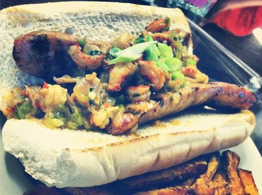 Alligator sausage poboy topped with crawfish etoufee!