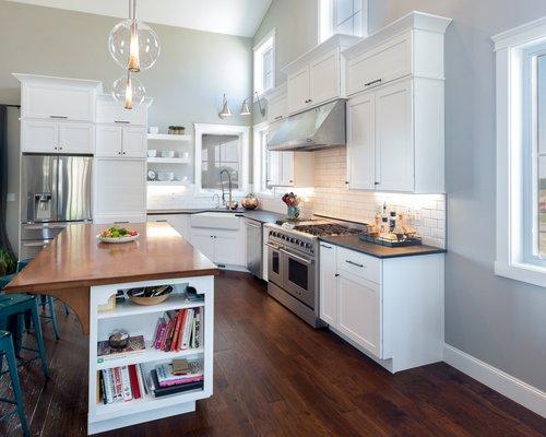 Soapstone, butcher block, white cabinets & floating shelves. #woodlandcabinetry