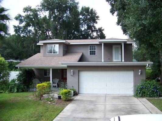 Custom 2 story home w/deck over garage overlooking a beautiful golf coarse.