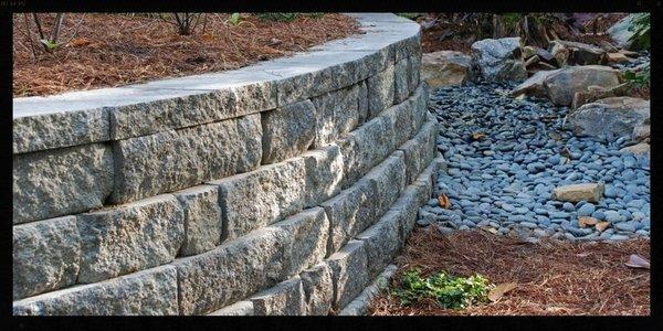 This retaining wall was installed to ensure that the grading of the property did not collapse on itself...