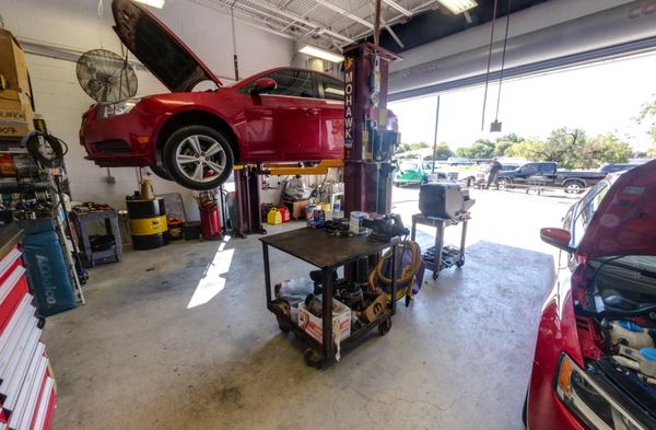 The busy service area of Southpoint Automotive, where cars are given top-notch care by skilled technicians.