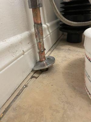 This was how they left one of the pipes. Shoddy welding work, broken tiles, and just no attention to detail.