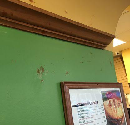 What is that brown stuff smeared on the walls? Why don't they clean it?