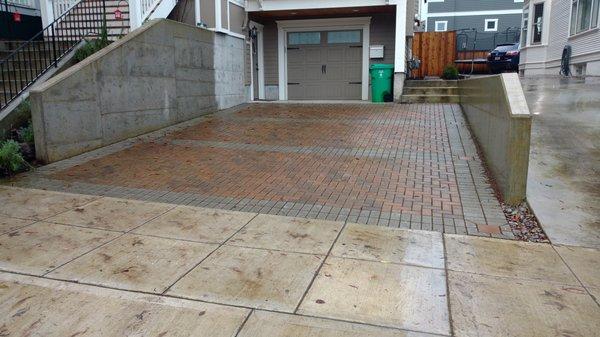 Freshly washed paver driveway finished.