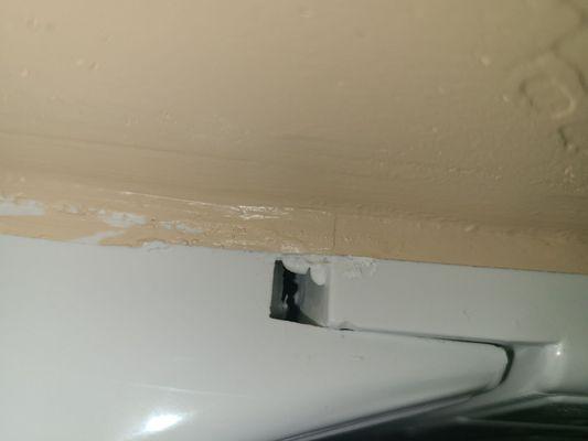 Huge gap at the top of the shower where water could easily get in and cause more damage