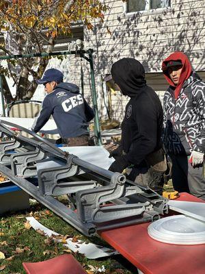 Workers making Aluminum trimmings for windows