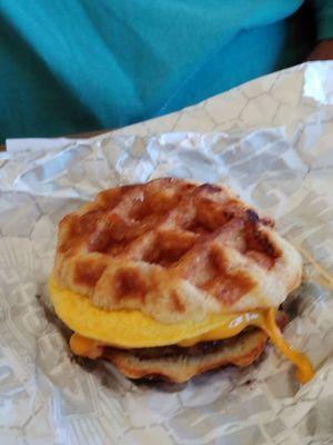 Sausage egg and cheese on waffle sandwich.