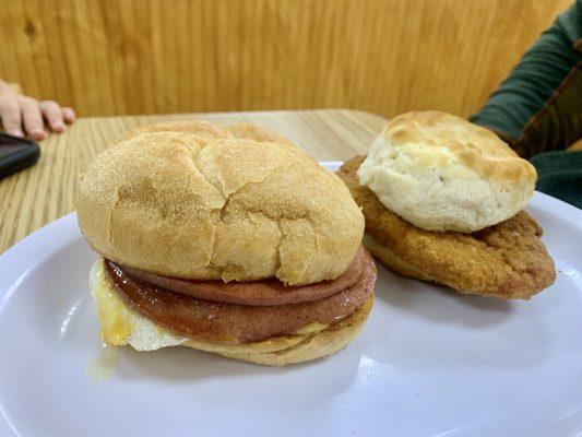 Fried bologna, egg, and cheese on Kaiser roll. Chicken and biscuit.