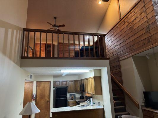 Living room looking at kitchen and upstairs