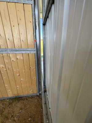 Another view of the large gap between barn doors and barn.