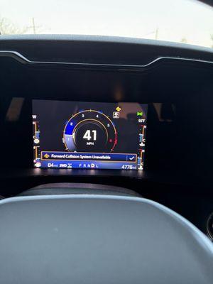 the dash showing the obvious light and the warning that pops up on it.