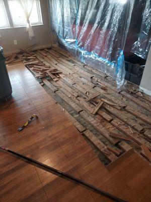 Old flooring warped from water damage