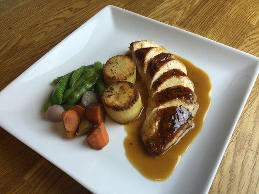 Sous vide pastured chicken breast, Pommes Fondant, citrus-thyme jus.