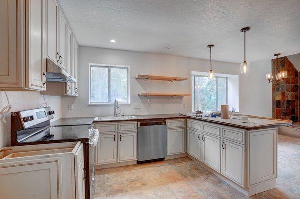 missing countertop to the left and missing back splash.