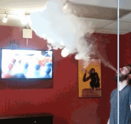 Jesse blowing clouds in the Black Dog Vapes Lounge