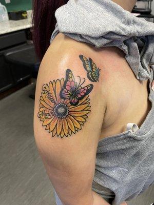 Sunflower with my kids name and two butterflies to represent each of them.