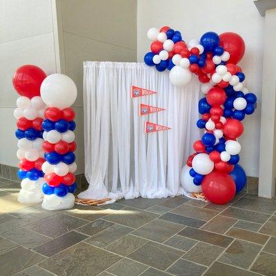 Balloon garland photo op and traditional balloon columns