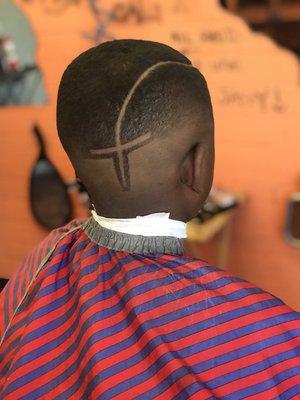 Skin fade with a part to a cross in the back head!