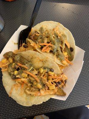 Delicious fried avocado taco with ranchera-style slaw that's delicious and Spanish rice beneath