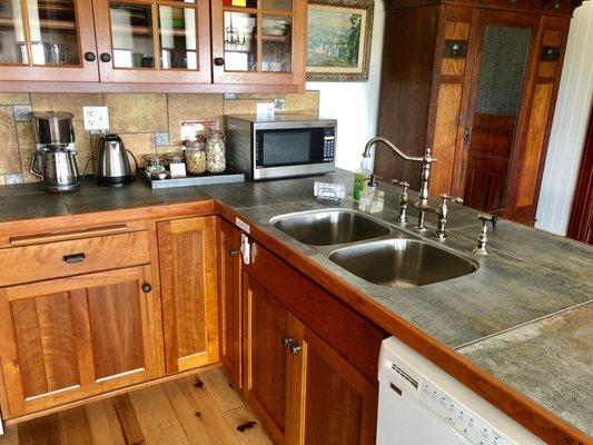 Kitchen counter and breakfast bar using 2 ft ceramic tile which is virtually indestructible and will not stain.