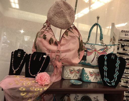 Pink and dragonfly purses and beautiful necklaces to match