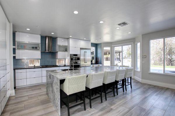 Full height glass backsplash to add the finishing touches for a modern kitchen look. - Genoa Tile