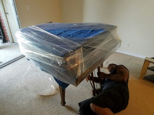 Pianos, Chandeliers, our White glove Treatment. EZ Movers.