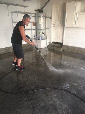 Steam power washing cement garage floor