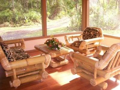 Screened in living room with over sized bamboo furniture