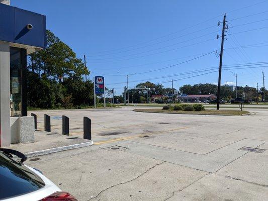 Outside. View from Pump 5 of 8, facing Airport Road and the street sign for Marathon.