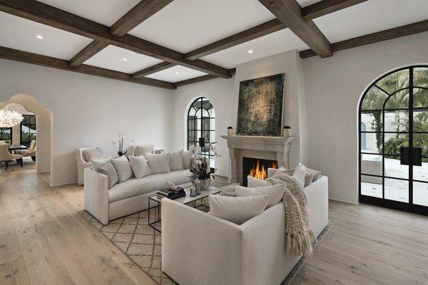 Sina Omidi Real Estate in Santa Barbara & Montecito - renovated living room with gorgeous double sided fireplace and french doors.