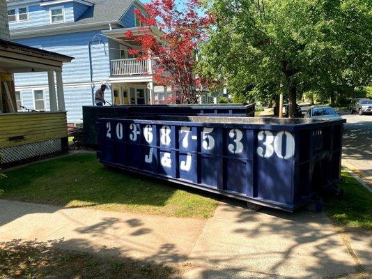 Second dumpster dropped on city sidewalk and front lawn