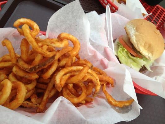 Pretty large servings. Displayed are large curly fries and a 1/4 pounder with cheese.