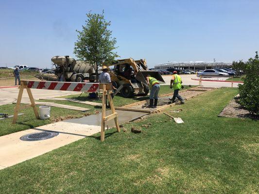 Installing a concrete sidewalk at a business park