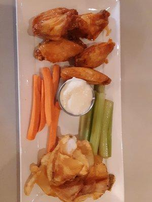 Buffalo wings served with celery sticks, carrot sticks blue cheese, and Pub chips.