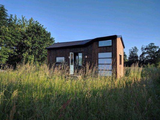 The exterior of a custom designed and built tiny house in Sweden.