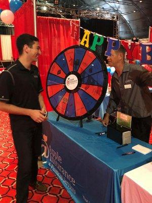 Our agent Matt and a bright eyed lad spinning the wheel at the Annual Boomer Expo! Last week was a Blast!