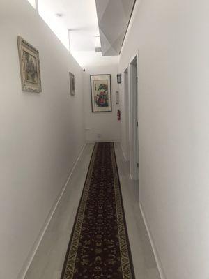 Spaclous hallway painting  and carpot